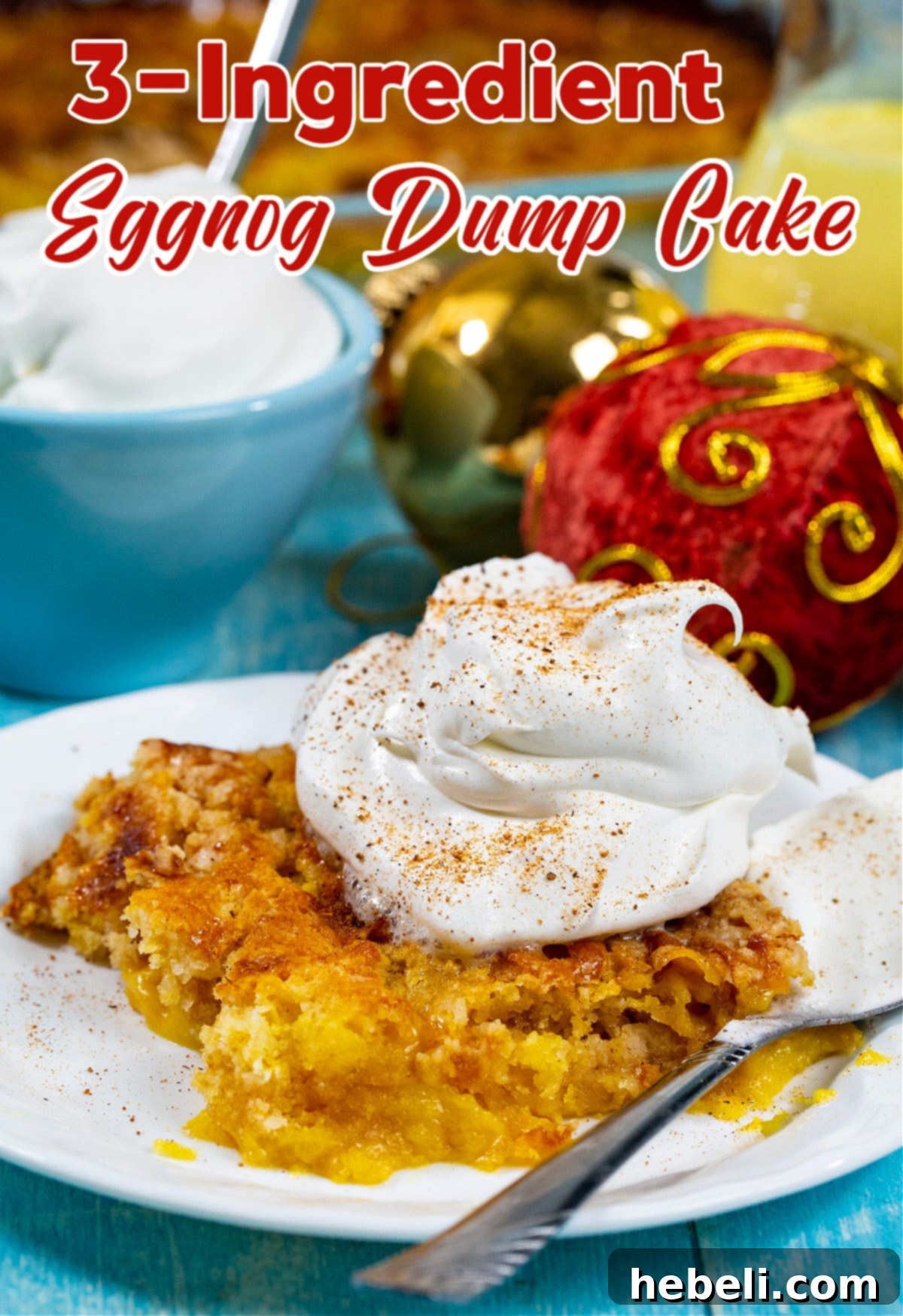 A close-up shot of a beautifully baked 3-Ingredient Eggnog Dump Cake, richly golden, with a dollop of whipped cream and a dusting of nutmeg.