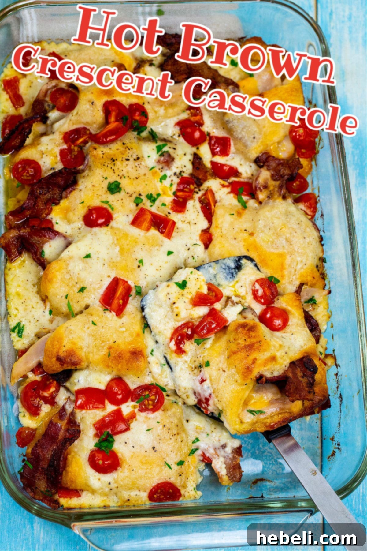 Kentucky Hot Brown Crescent Bake 4 A different angle of the Hot Brown Casserole in a baking dish, showcasing its golden crust and bubbling sauce, ready to be served.