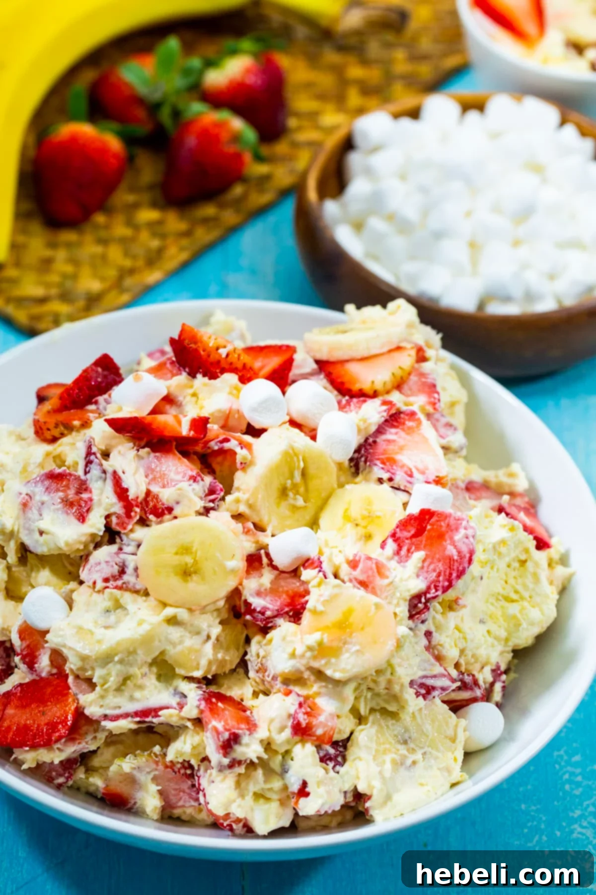 Strawberry Banana Cheesecake Salad in a serving bowl, garnished and ready to be enjoyed.