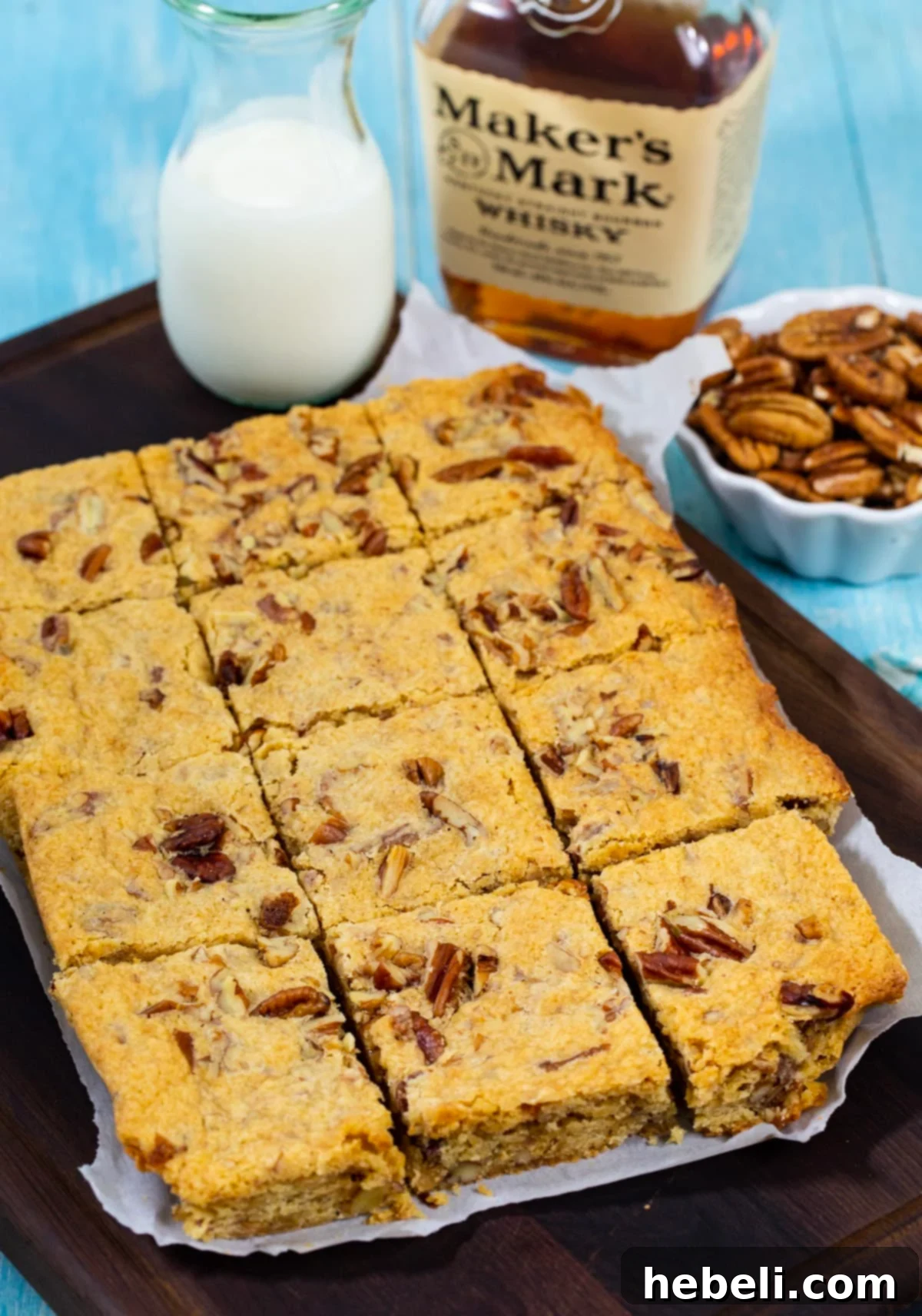 Perfectly cut squares of Bourbon Pecan Blondies arranged on a serving board.