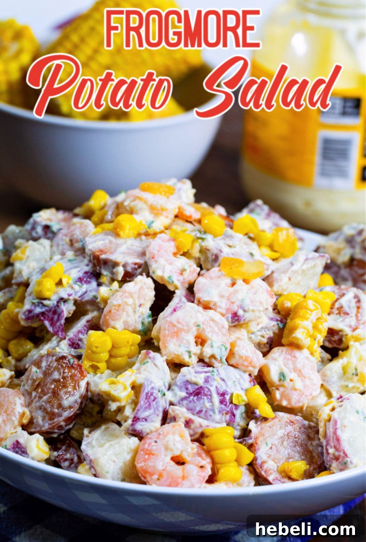Close-up view of Frogmore Potato Salad in a rustic bowl, garnished with green herbs, emphasizing its inviting texture.
