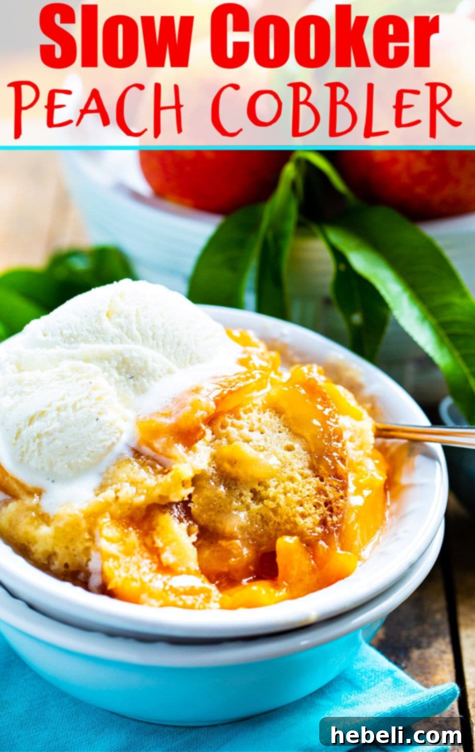 Set-It-and-Forget-It Peach Cobbler 6 A delicious Slow Cooker Peach Cobbler, bubbling with juicy peaches and a golden-brown topping, ready to be served as an easy summer dessert.