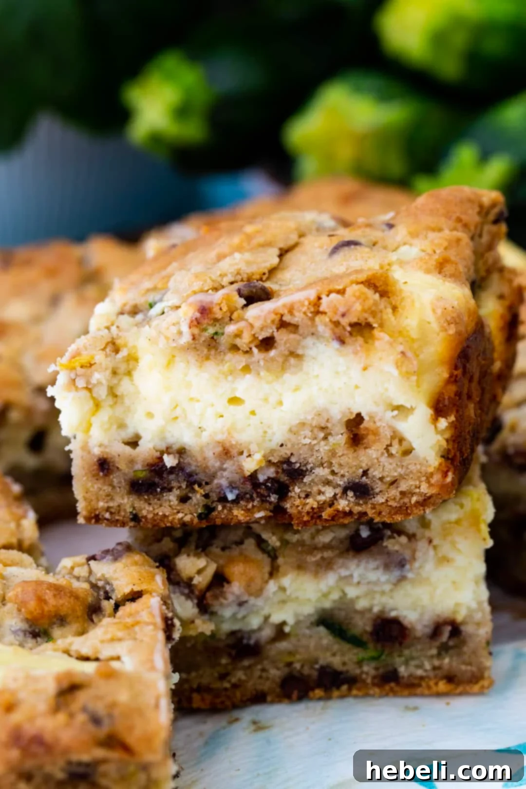 Zucchini Cheesecake Bliss Bars 4 Stacked Zucchini Cheesecake Bars, showing their tempting layers.