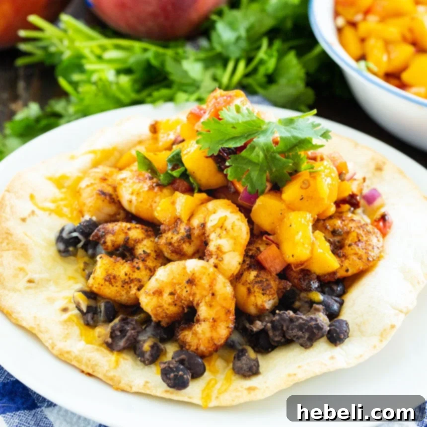 Sweet Peach Shrimp Tostadas 2 Crispy tostada generously topped with seasoned black beans, succulent sautéed shrimp, and fresh cilantro, ready to be enjoyed.