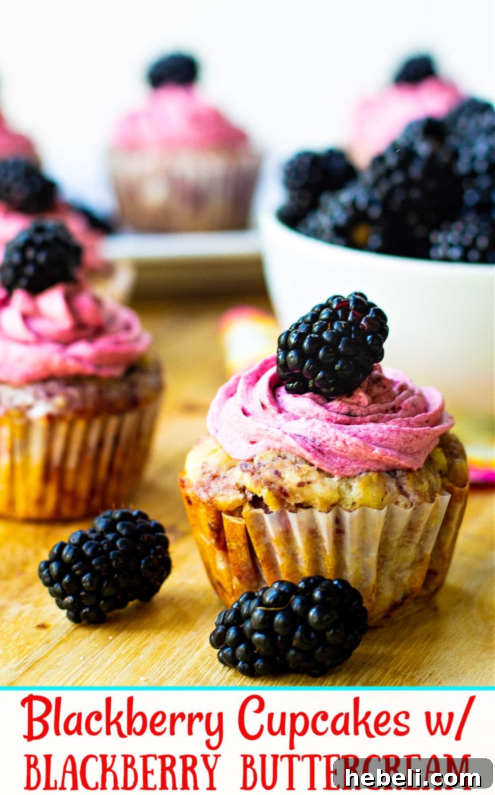 Velvet Blackberry Cupcakes 7 Stacked blackberry cupcakes showcasing the delicious buttercream and fresh berry topping.