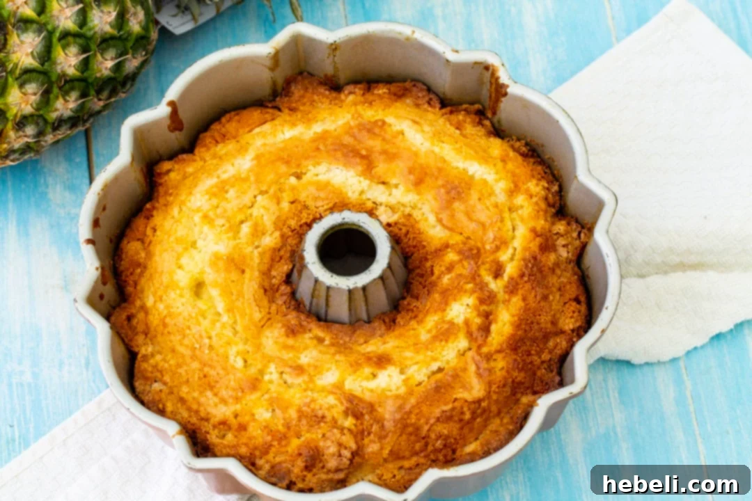 A delicious Pineapple Pound Cake still in the bundt pan, ready to be inverted.