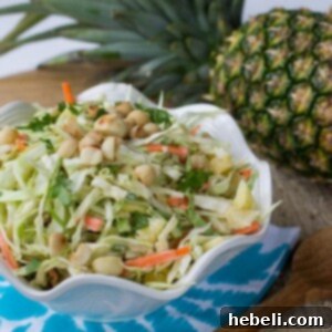 Close-up of Pineapple Macadamia Slaw with Coconut and green onions.