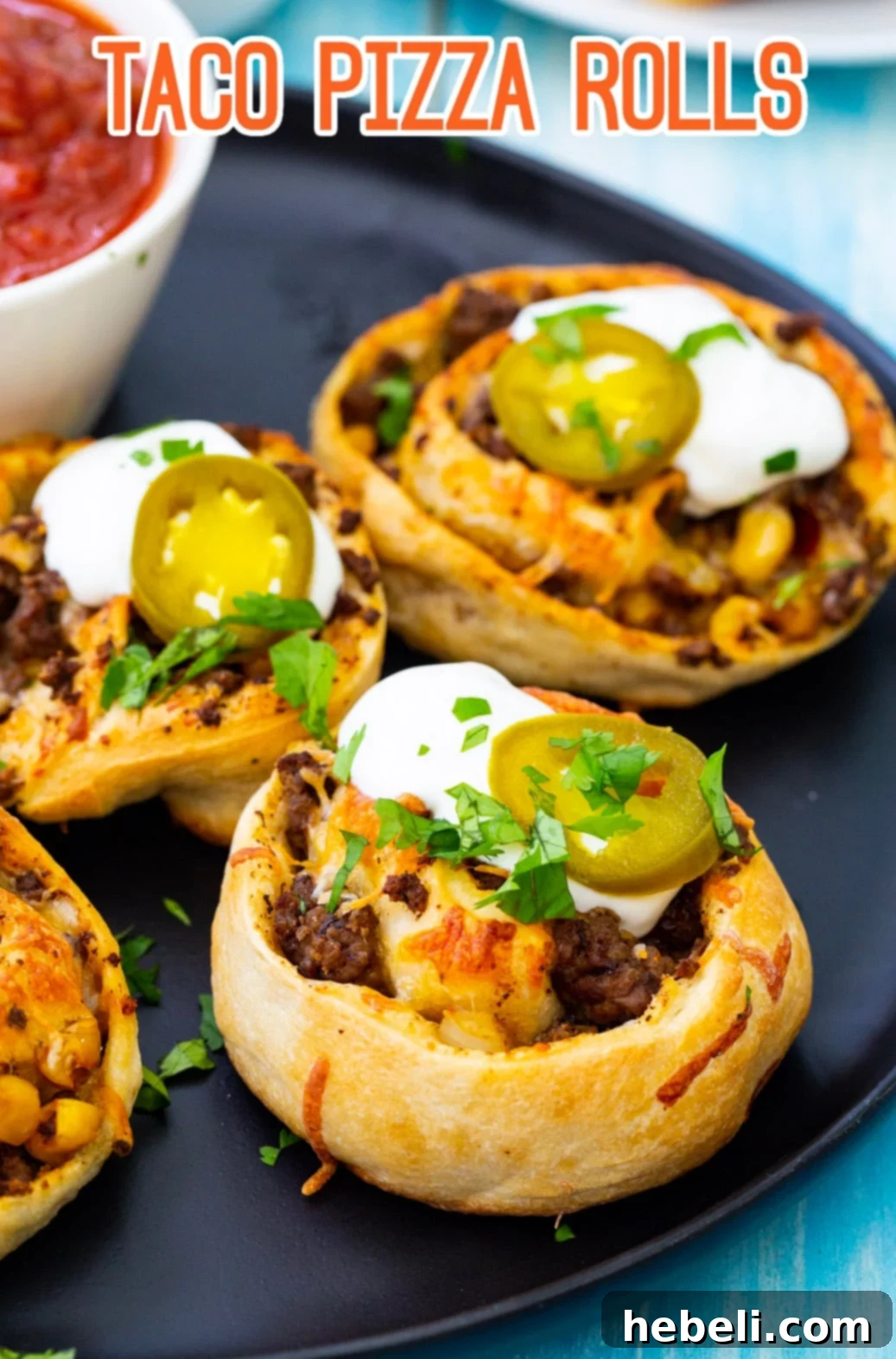 Fiesta Pizza Rolls 7 A stack of golden Taco Pizza Rolls on a vibrant red serving plate, showcasing their inviting texture.
