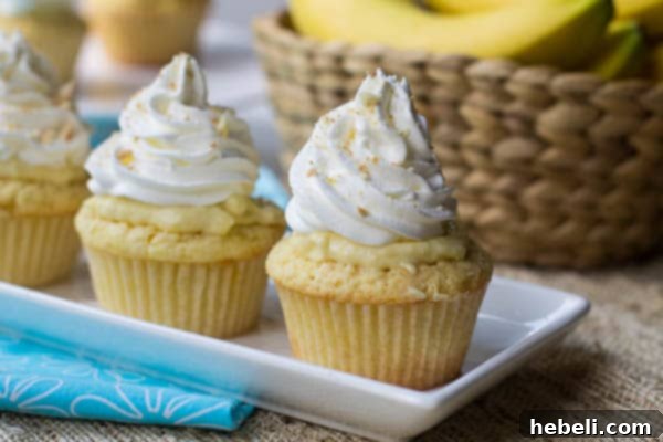 Delicious Banana Pudding Cupcakes with whipped cream and vanilla wafers