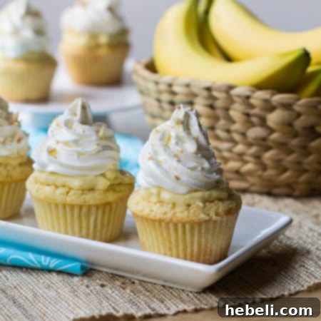 Close-up of a Banana Pudding Cupcake showing the creamy filling and banana pieces