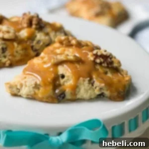 Delicious Turtle Scones, garnished with caramel and walnuts, ready to be enjoyed.