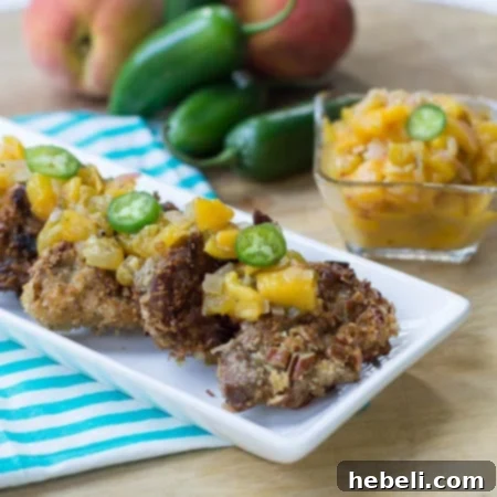 Pecan-Crusted Pork Medallions topped with peach chutney and jalapeno slices.