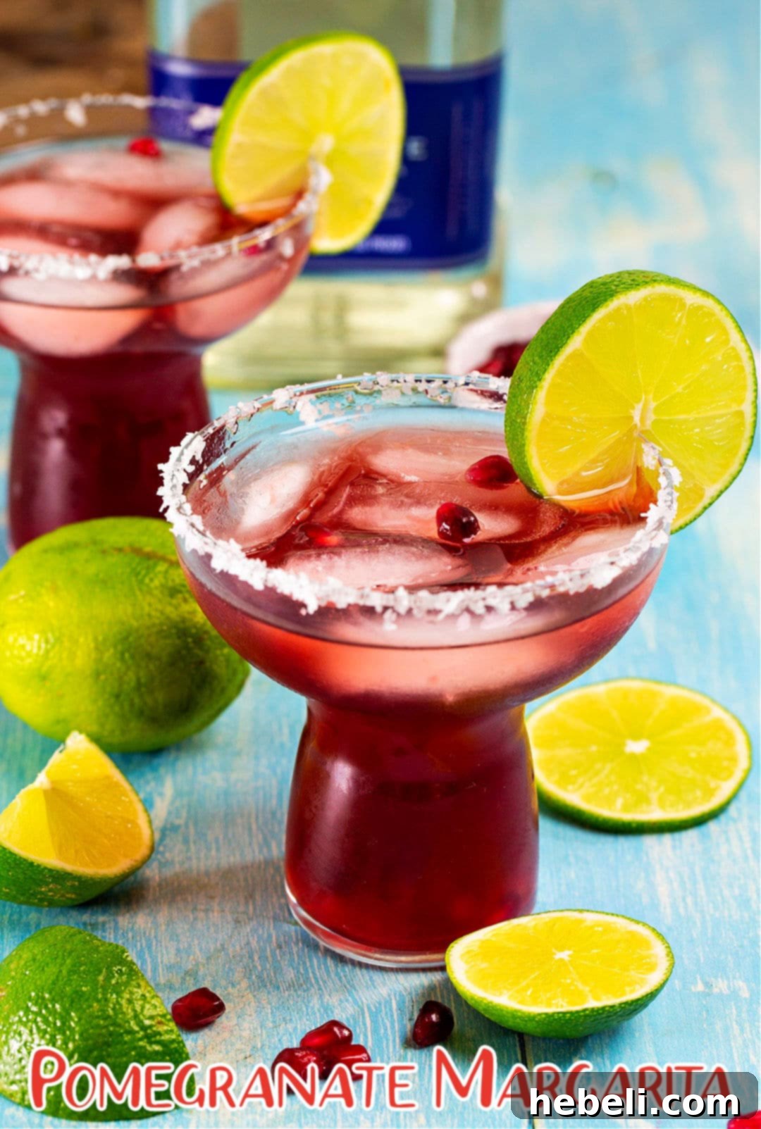 Perfect Pomegranate Margarita 5 Two vibrant Pomegranate Margaritas served in elegant glasses, ready for a festive occasion.