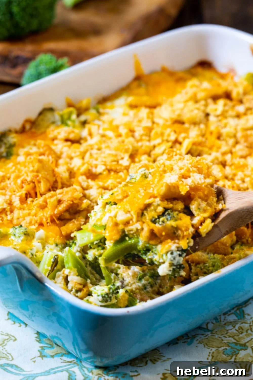 Close-up of baked Southern Broccoli Casserole in a dish, showcasing the golden cracker topping and melted cheese.