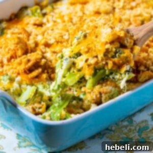 Wooden spoon scooping up Southern Broccoli Casserole.