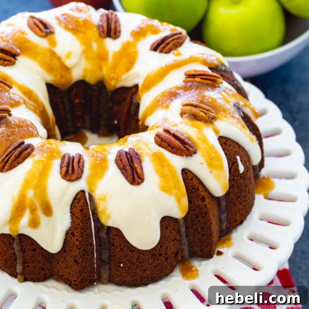 Beautifully baked Caramel Apple Pound Cake on an elegant cake stand, ready to be served as a delightful fall dessert.