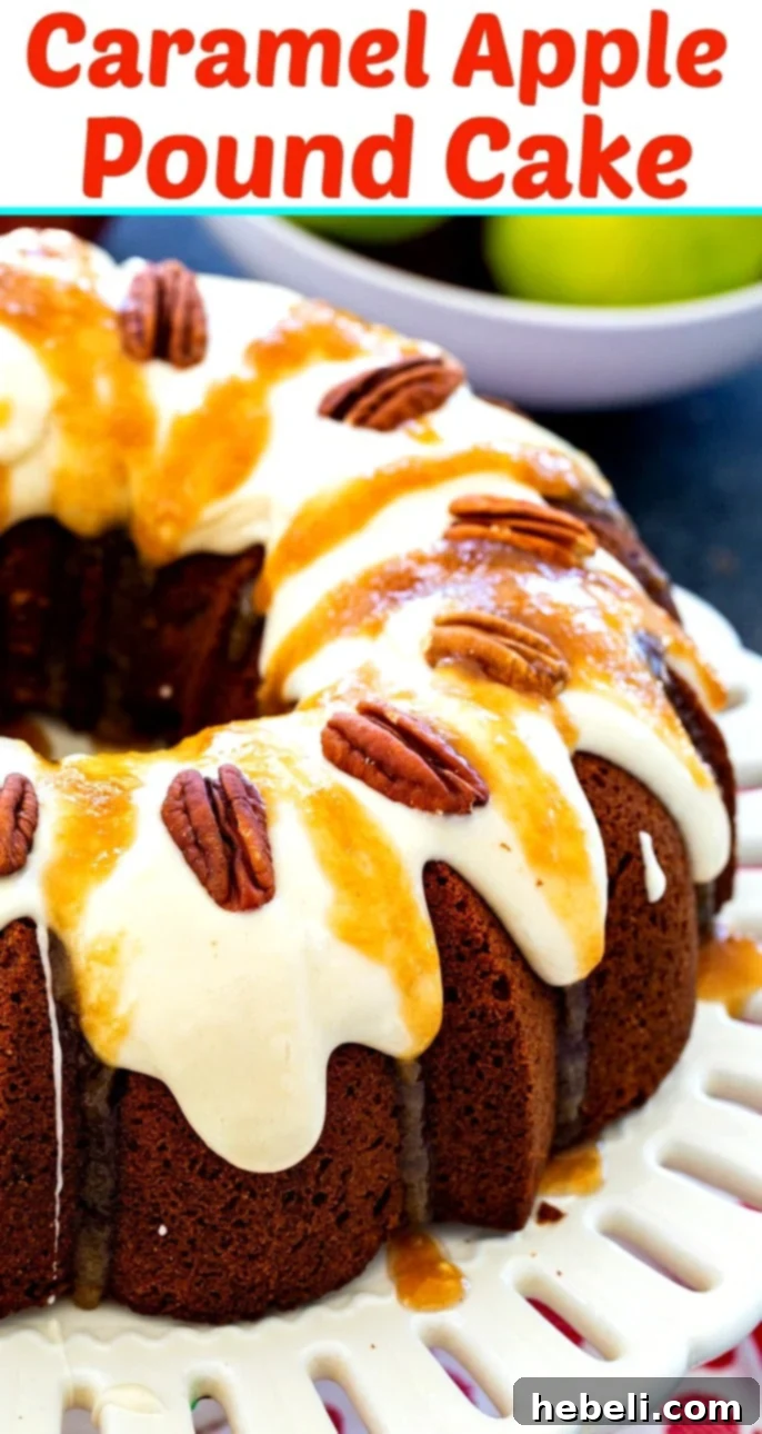 Overhead view of a beautifully decorated Caramel Apple Pound Cake with intricate cream cheese icing and caramel drizzle patterns, garnished with pecan halves, showcasing its luxurious appeal.