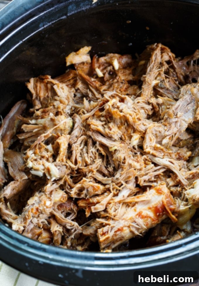 Close-up of Slow Cooker Carolina-Style Pulled Pork, showing its tender texture.