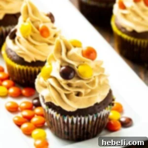 Chocolate Reese's Cupcakes topped with peanut butter frosting on a serving platter.