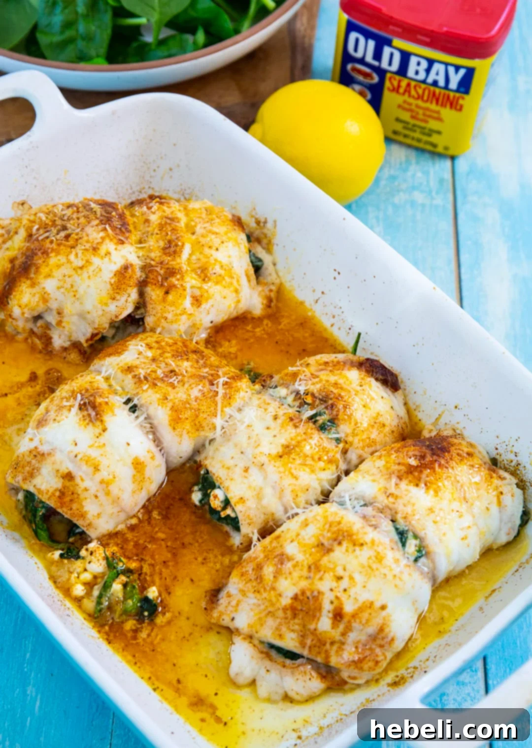 Flounder Fillets Stuffed with Creamy Spinach 5 Stuffed flounder in baking dish, seasoned and ready for the oven.