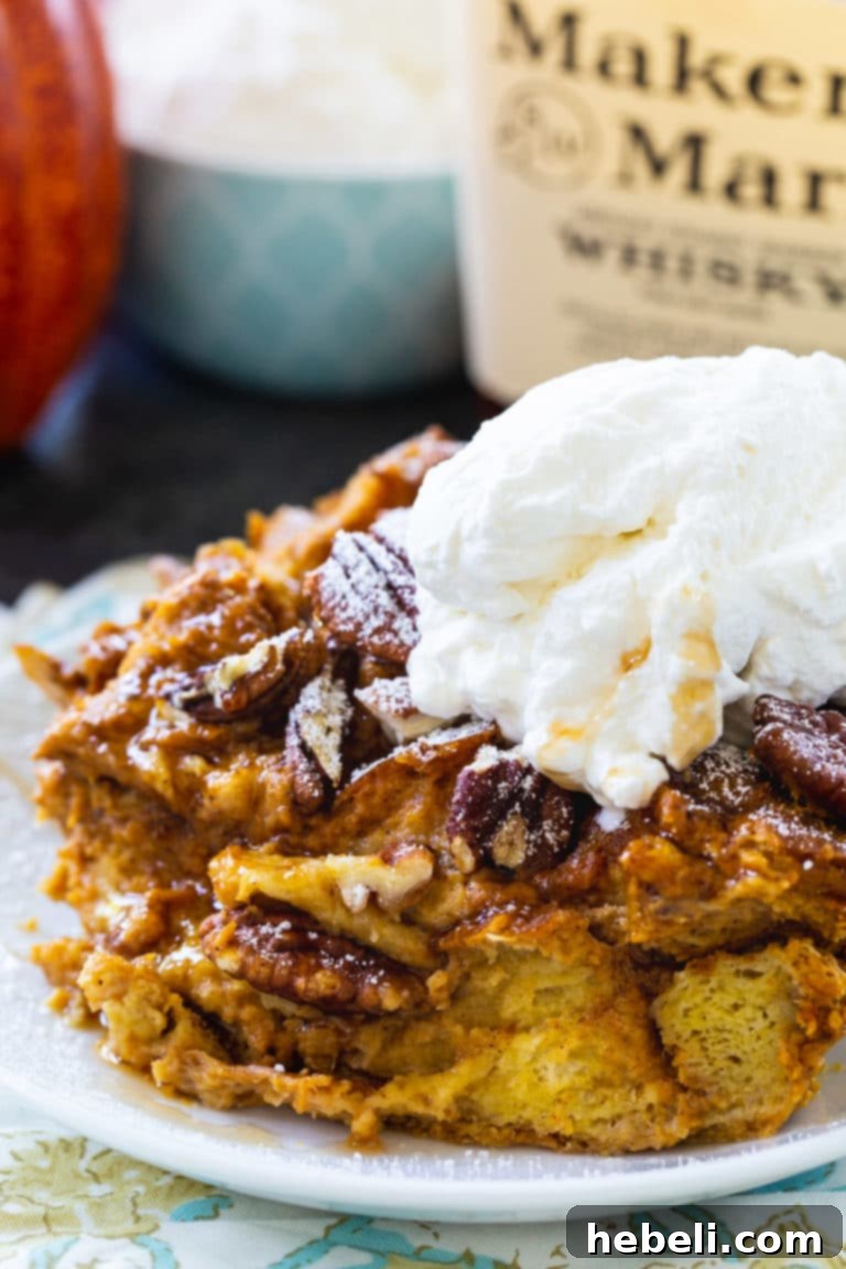 Spiced Pumpkin Bread Pudding with Bourbon Cream 4 Full baking dish of Pumpkin Bread Pudding, golden brown and garnished, ready to be served.