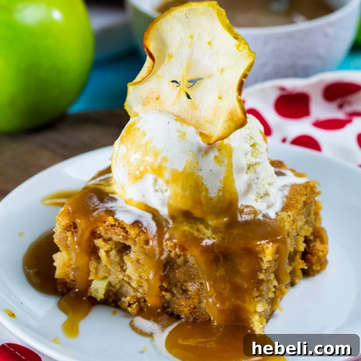 Ultra rich and sweet butterscotch apple bars topped with vanilla ice cream, an easy caramel sauce and apple chips.