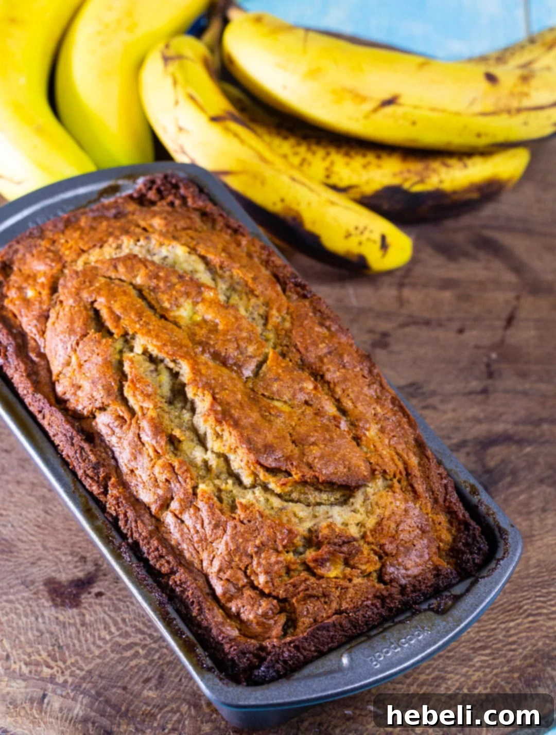 Decadent Chocolate Glazed Banana Bread 3 Cooked Banana Bread in a loaf pan, freshly baked and golden brown.