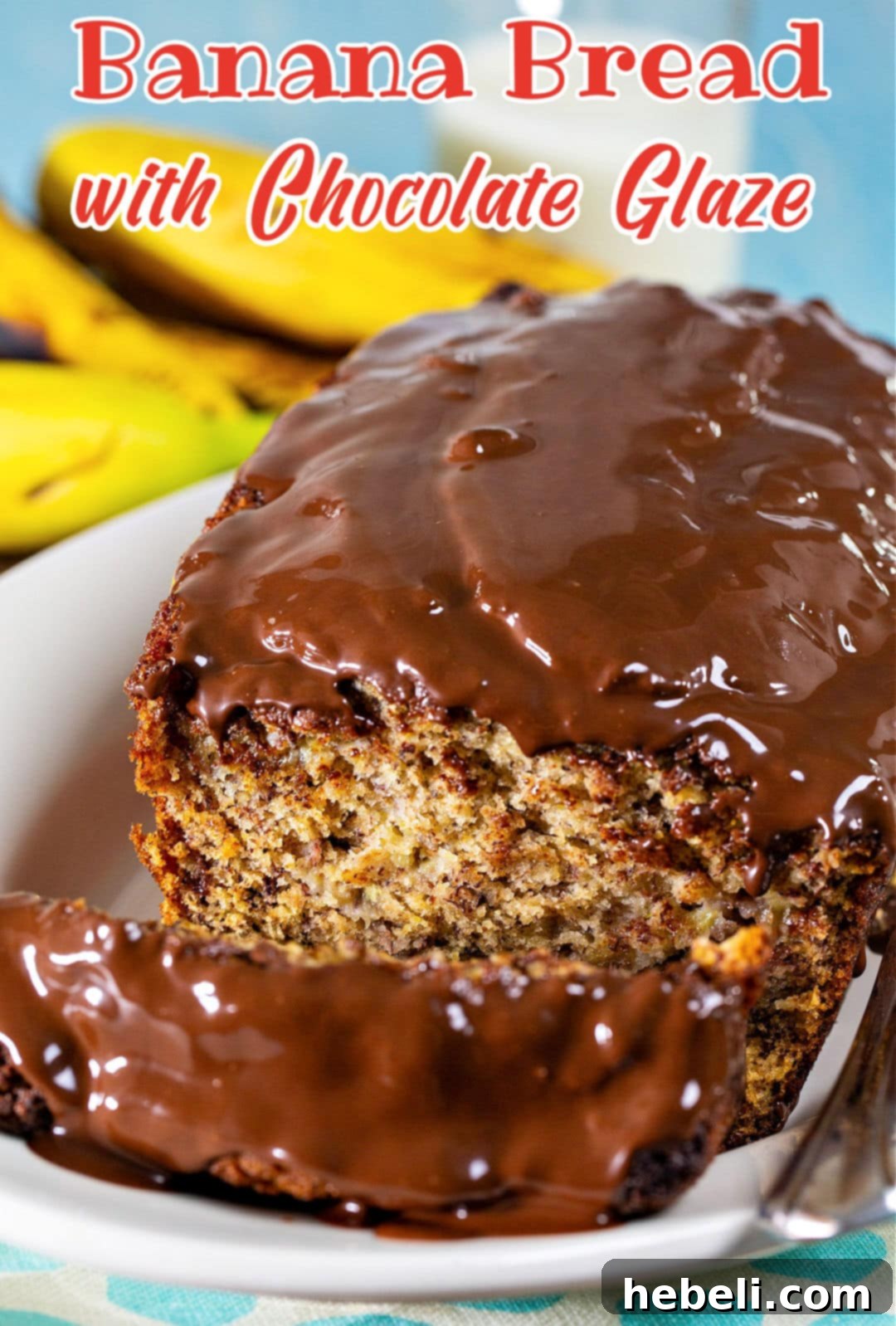 Decadent Chocolate Glazed Banana Bread 6 A freshly baked slice of Lightened Up Banana Bread with Chocolate Glaze on a plate.