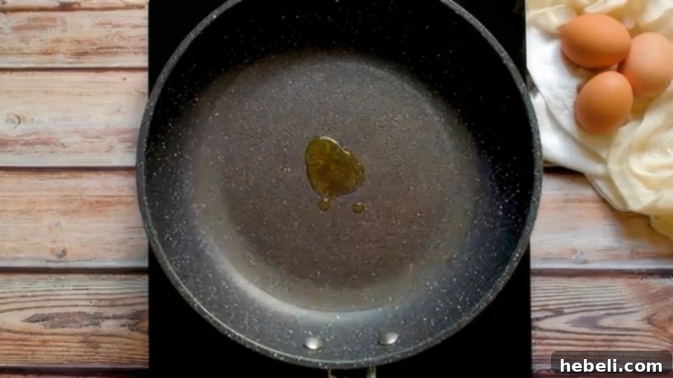 Fluffy Buttermilk Pancakes 6 Vegetable oil heating up in a nonstick griddle pan.