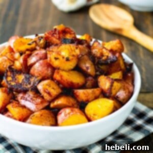 Bowl full of potatoes cooked with paprika.