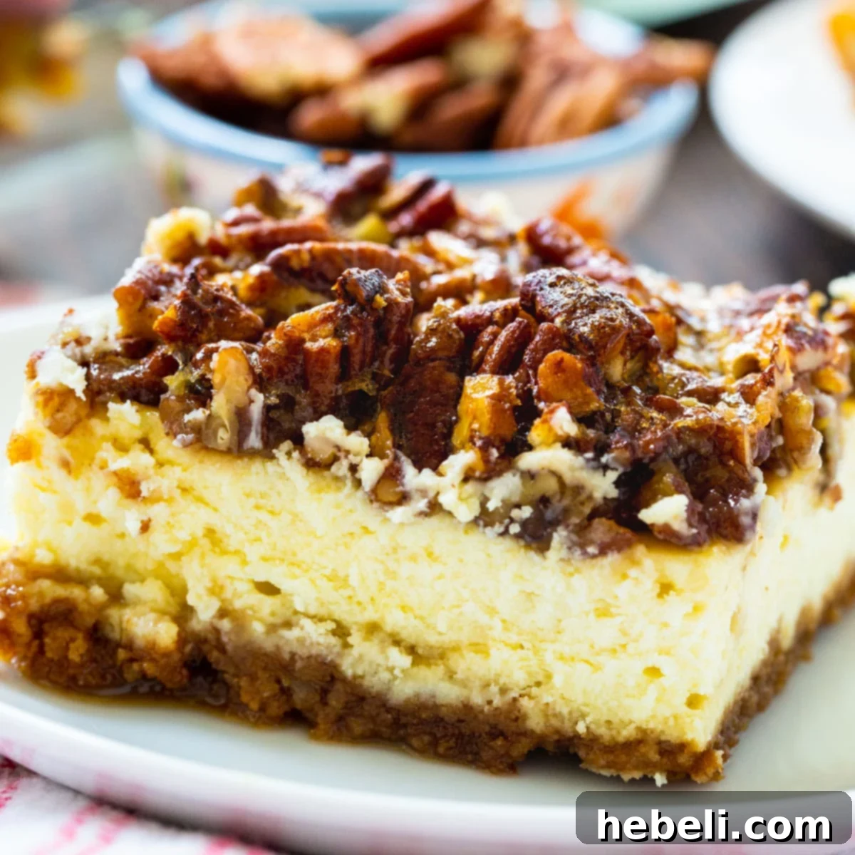 The Pecan Pie Universe 17 Delicious Pecan Pie Cheesecake Bars, perfectly portioned for easy serving and enjoyment.