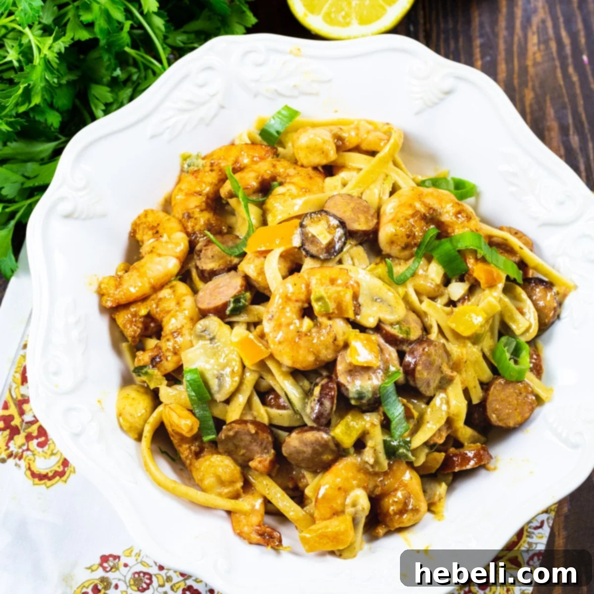 Spicy Cajun Pastalaya 2 Cajun Pastalaya in a pasta bowl, garnished with fresh herbs.