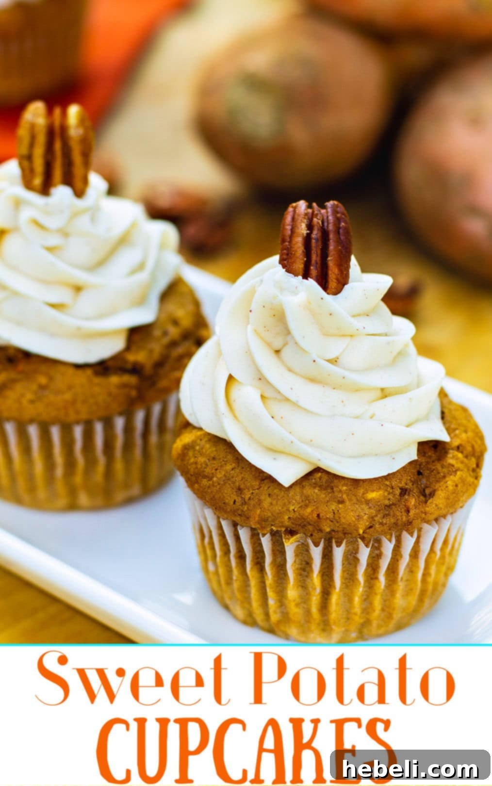 Close-up shot of a single Sweet Potato Cupcake, beautifully frosted with spiced buttercream and topped with a pecan, highlighting its enticing texture and garnish.