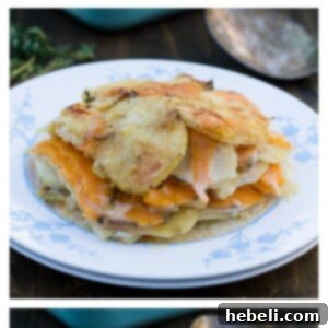 Caramelized Onion and Potato Gratin topped with a thick layer of golden-brown Gruyère cheese, fresh out of the oven.