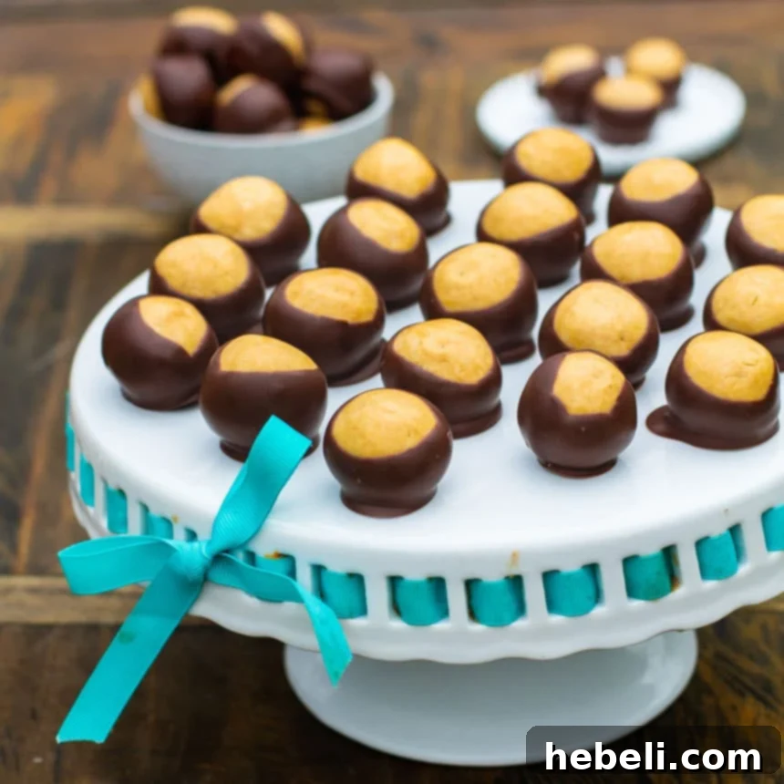 Buckeye Balls on a white cake stand.