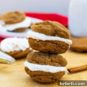 Stacked chewy gingerbread sandwich cookies with marshmallow filling.