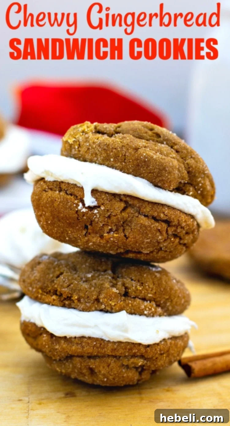 A close-up of several chewy gingerbread sandwich cookies, showing their perfect texture and delicious marshmallow filling.