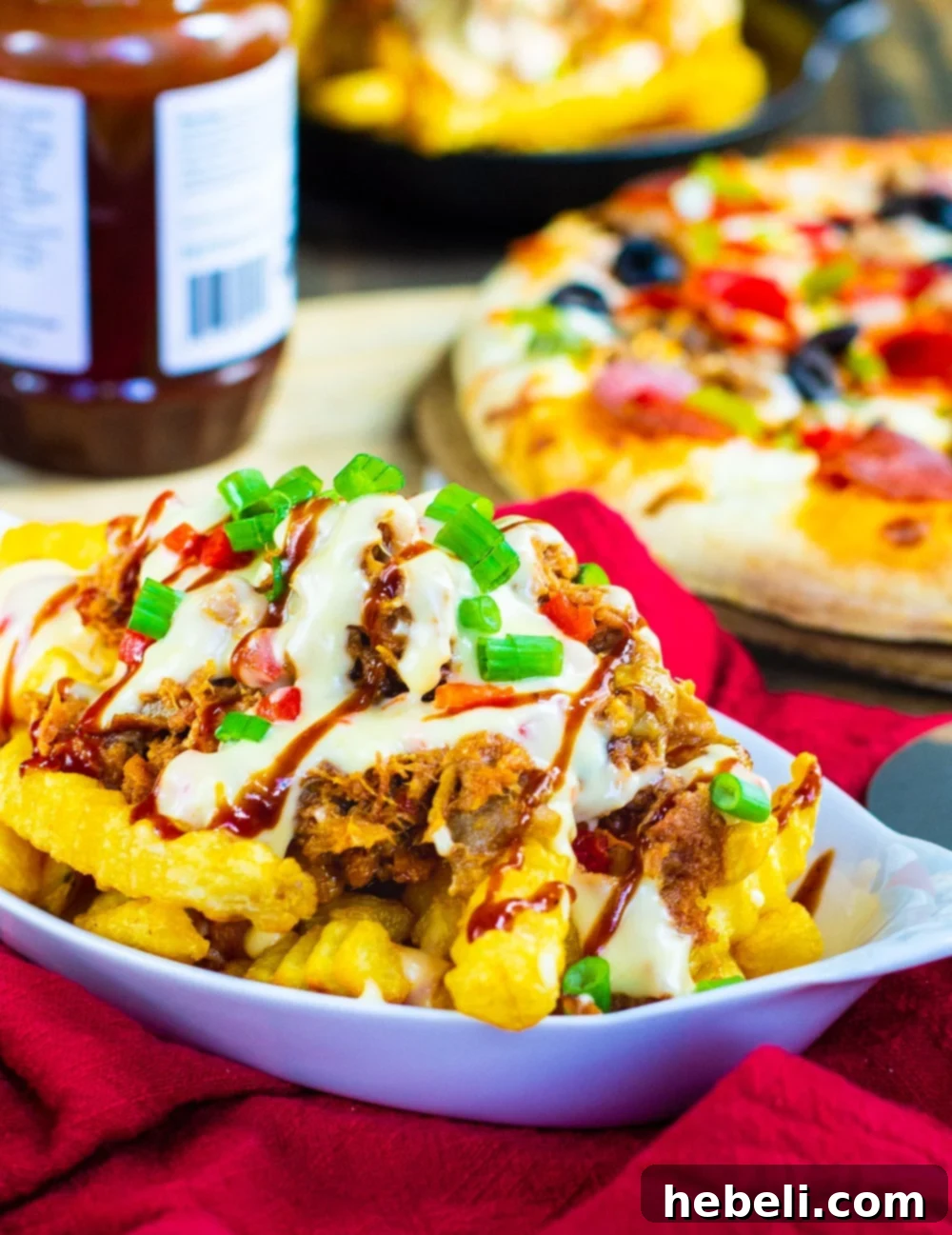 Southern Comfort Cheese Fries 3 Pile of crispy crinkle-cut fries topped with generous portions of smoky BBQ pulled pork and creamy pimento cheese sauce, garnished with fresh green onions, ready to serve.