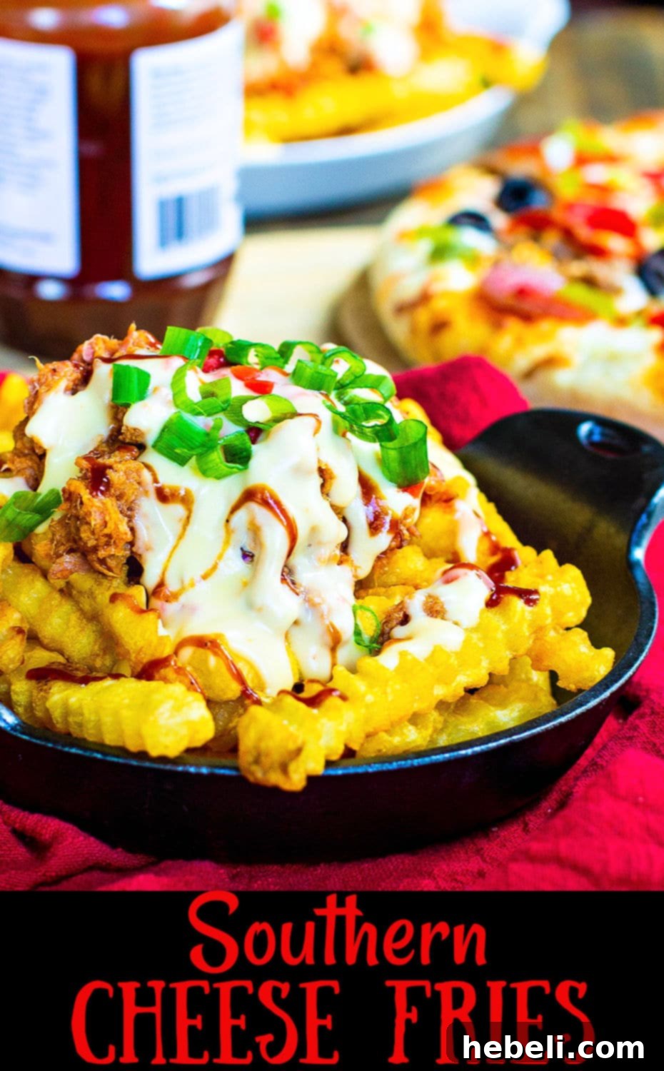 Southern Comfort Cheese Fries 4 Close-up of Southern Cheese Fries with pulled pork and pimento cheese sauce, expertly garnished with sliced green onions and a final drizzle of BBQ sauce, highlighting the rich textures.