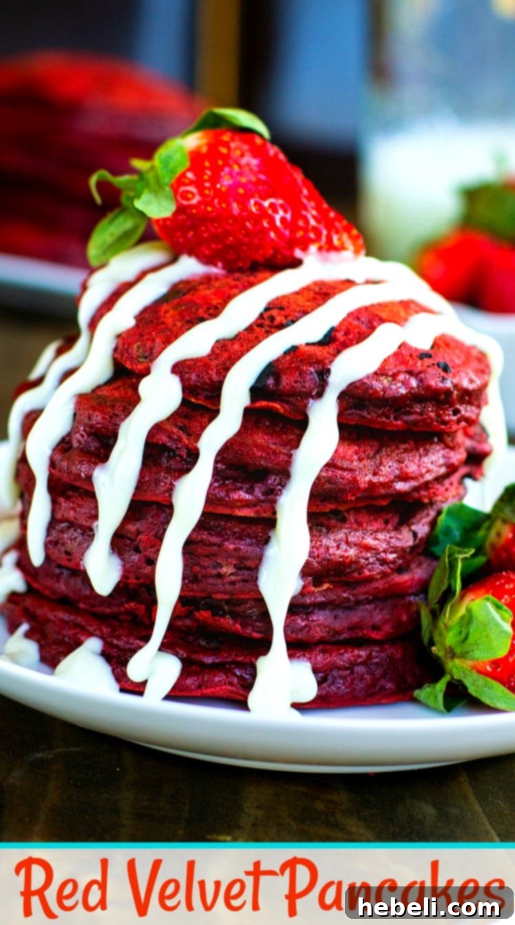 Close-up of a stack of Red Velvet Pancakes with cream cheese glaze.