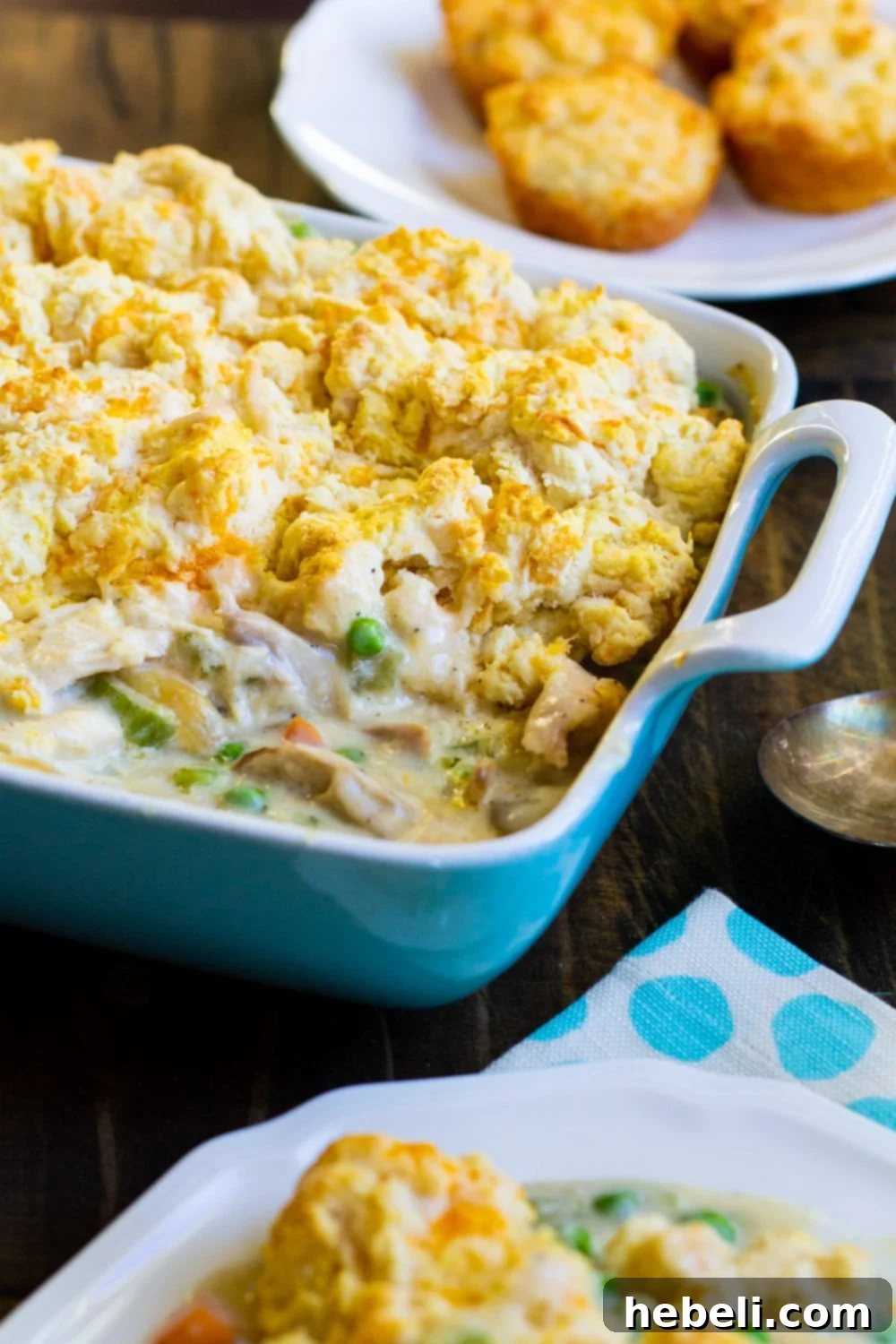 A freshly baked Chicken Cobbler in a baking dish, with golden biscuits.