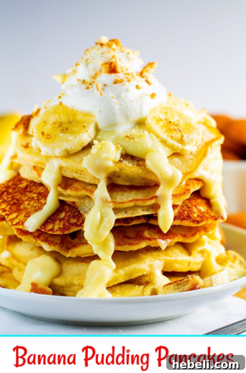 Decadent Banana Pudding Pancakes 6 Close-up of Banana Pudding Pancakes, showing the rich texture of the pudding sauce, banana slices, and crushed vanilla wafers on top.