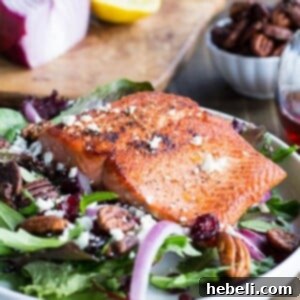 Seared Salmon over Mixed Greens with Dried Cranberries, Feta, and Candied Pecans