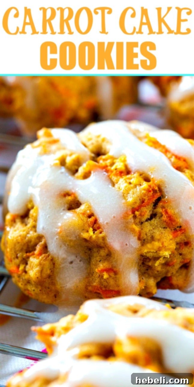A close-up shot of a single Chewy Carrot Cake Cookie, perfectly glazed with sour cream, ready to be eaten for a delightful treat. Ideal for Easter or any spring occasion.
