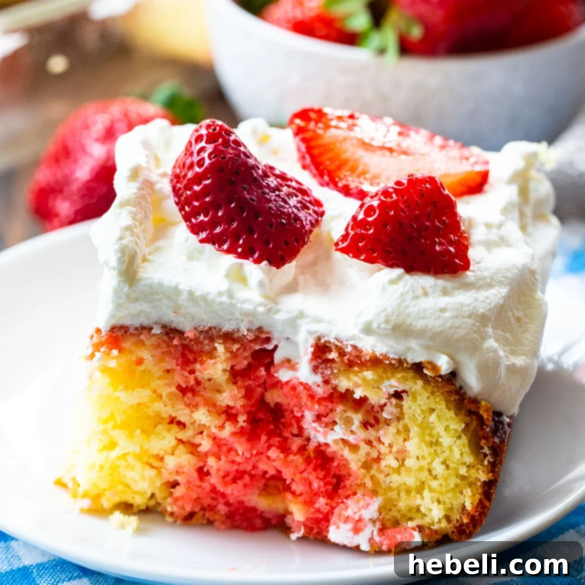 Easy Strawberry Flavored Poke Cake, a cool and creamy dessert