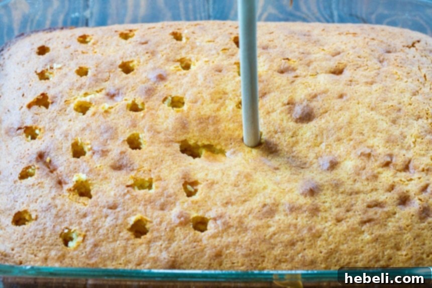 Poking holes in a freshly baked cake
