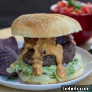 A perfectly assembled Nacho Burger, showing off its rich toppings.