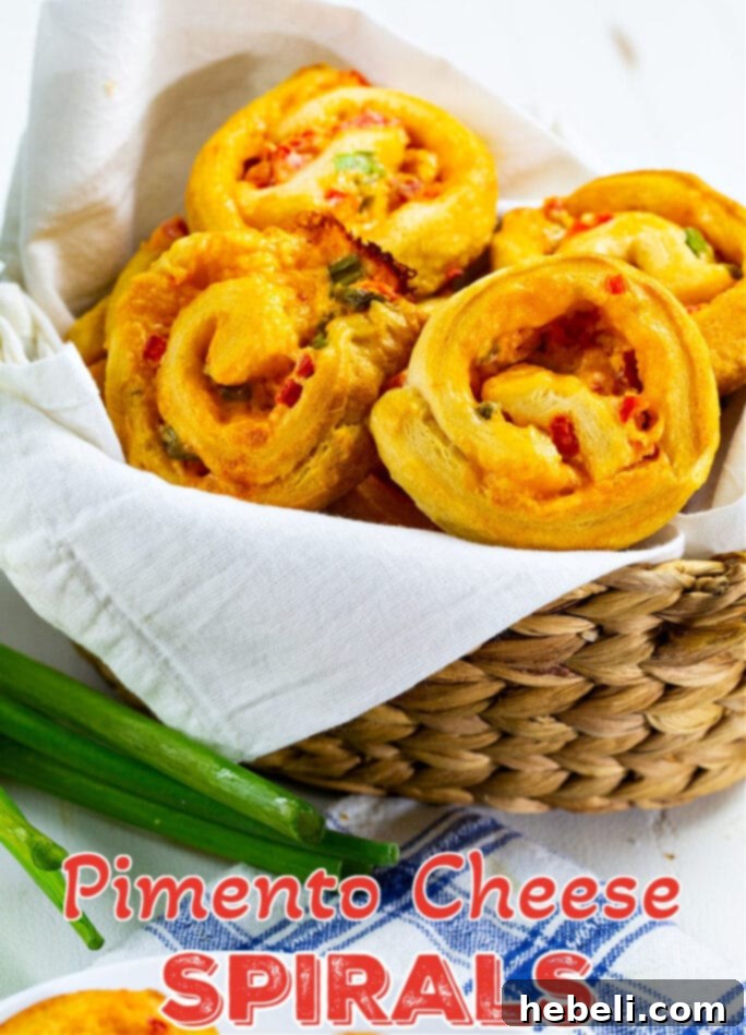 Pimiento Cheese Spirals stacked invitingly in a rustic basket, ready to be served.