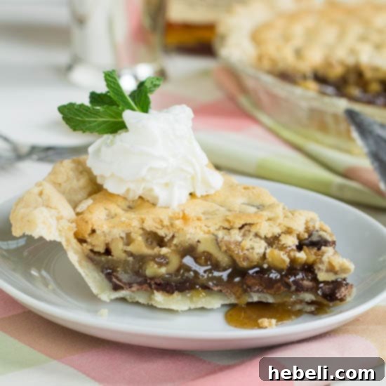 Thoroughbred Pie, a delicious bourbon chocolate walnut pie for Derby Day, presented on a wooden board