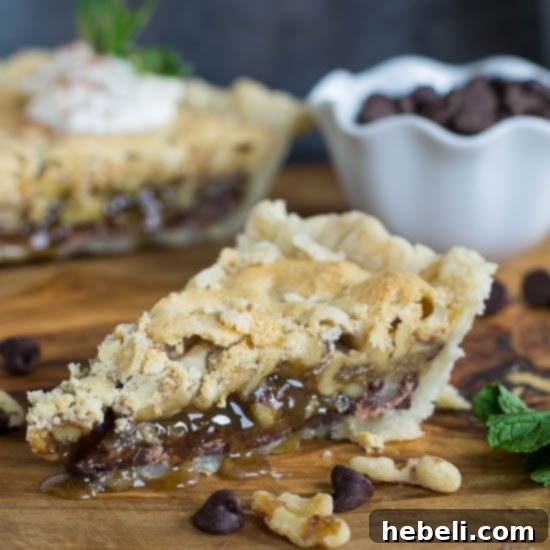 Two elegant slices of Thoroughbred Pie topped with Bourbon Whipped Cream, ready for serving